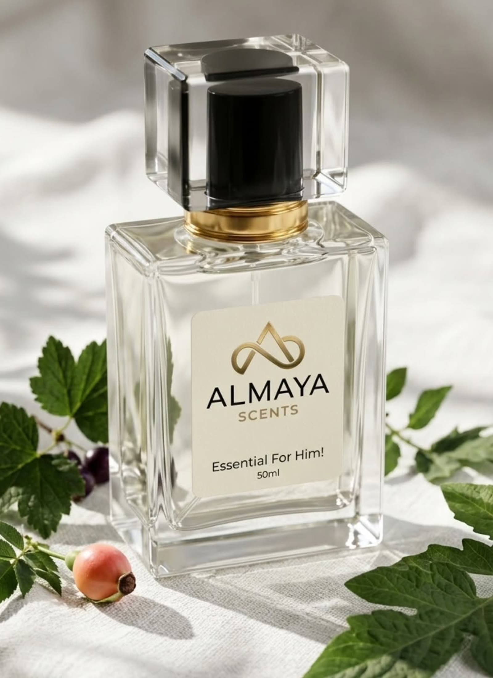 Essential For Him bottle on linen with fresh leaves and bright daylight